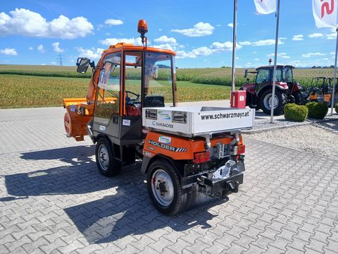 Holder C 240 mit Scheefräse, Schneeschild und Sichelmäh
