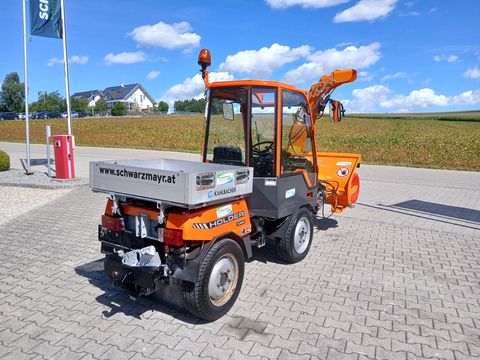 Holder C 240 mit Scheefräse, Schneeschild und Sichelmäh