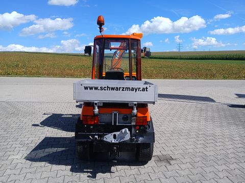 Holder C 240 mit Scheefräse, Schneeschild und Sichelmäh