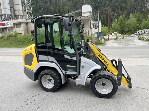 Kramer 5035 mit Erdschaufel und Palettengabel