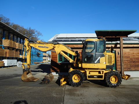 Komatsu PW 118WR-8 VA ( 13,5t ) mit Schild und Pratzen 