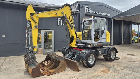 Wacker Neuson EW100 - POWERTILT - 4X BUCKETS - STABILIZERS