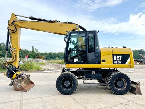 CAT M315D - 360° Engcon Rotating Bucket + Grapple