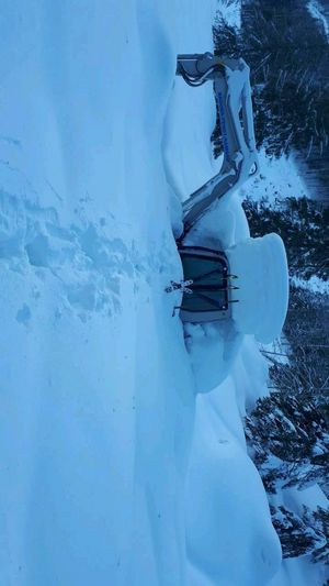 Takeuchi TB 290 bergen im schnee auf der alm